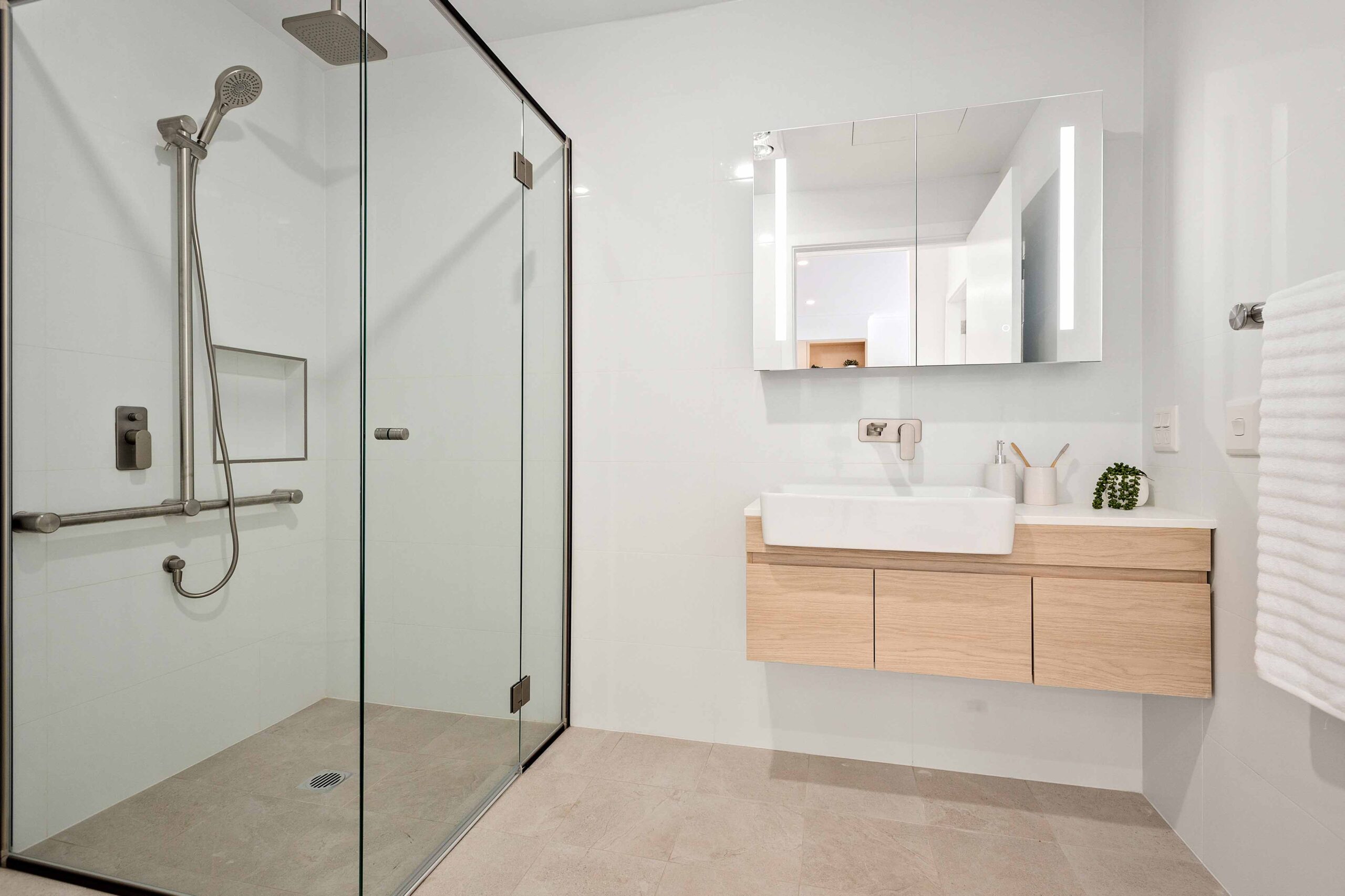 Bathroom shown shower vanity inside Warrigal Lake South villa